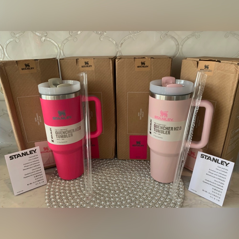 Light pink and hot pink 40 oz Stanley cups